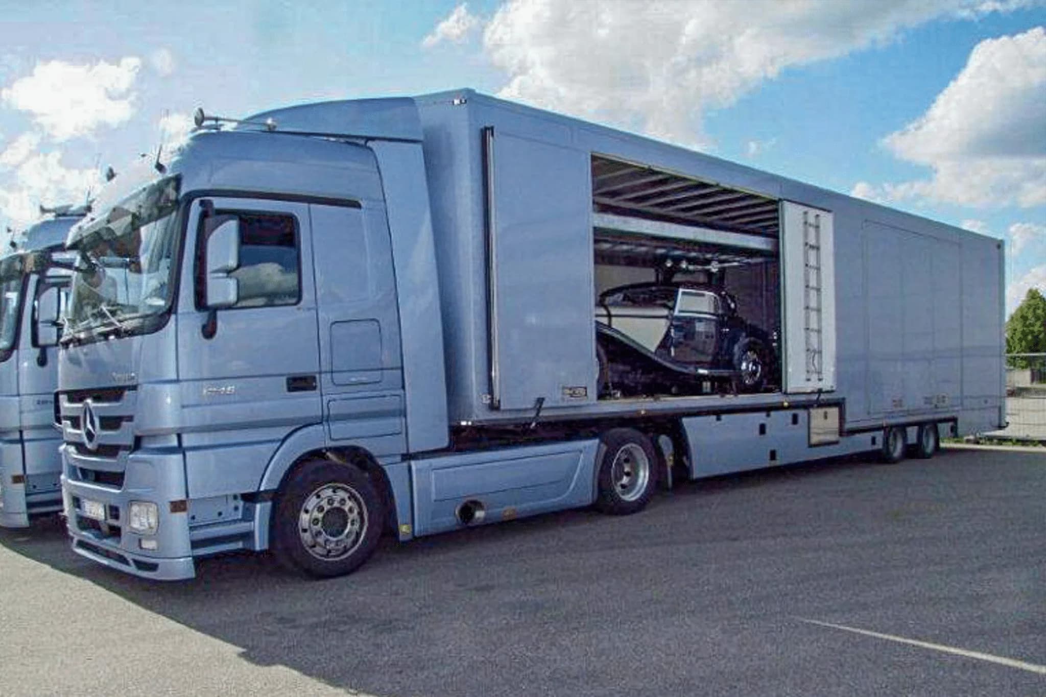 Mercedes Actros enclosed transporter fleet ready for classic car pickup